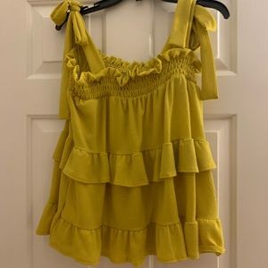 Yellow ruffled tank top.
